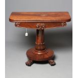 A VICTORIAN MAHOGANY FOLDING TEA TABLE of rounded oblong form with swivel top, leaf and scroll