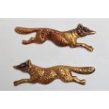 A PAIR OF EAST RIDING YEOMANRY "FOX IN FULL CRY" COLLAR BADGES, in yellow metal with rubies for