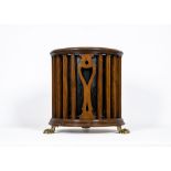 A MAHOGANY WASTE PAPER BASKET, 19th century, of cylindrical form, the slatted open sides spaced by