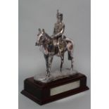 A FILLED SILVER EQUESTRIAN MODEL, maker Camelot Silverware, Sheffield 1999, the Dragoon seated