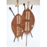 A PAIR OF REPRODUCTION ZULU SHIELD DISPLAYS SIGNED BY ACTOR HENRY CELE, both with classic hide