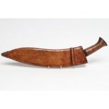 A MILITARY KUKRI, the 13 3/4" curved and fullered blade stamped "PIONEER CALCUTTA 43", two piece