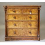A VICTORIAN WALNUT STRAIGHT FRONTED CHEST, the protruding front corners housing baluster turned