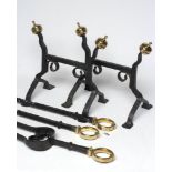 A SET OF ARTS AND CRAFTS STYLE WROUGHT IRON FIRE IMPLEMENTS, the square section shafts with spiral