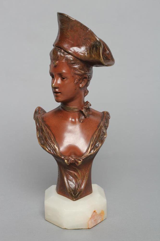 AFTER GEORGES VAN DER STRAETEN (Belgian 1856-1941), a bronze bust of a stylish young lady wearing