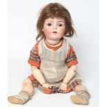 A Franz Schmidt & Co. bisque socket head doll, with brown glass sleeping eyes, open mouth, applied