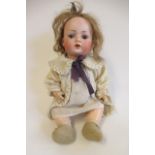 A Bahr & Proschild bisque socket head doll, with brown glass sleeping eyes, open mouth, teeth, light