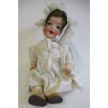 A Heubach Koppelsdorf bisque socket head character doll, with blue glass flirty eyes, sleeping