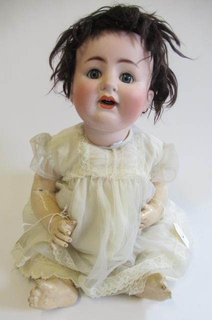 An Alt, Beck & Gottschalck bisque socket head doll, with blue glass sleeping eyes, open mouth, two