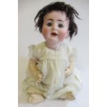 An Alt, Beck & Gottschalck bisque socket head doll, with blue glass sleeping eyes, open mouth, two