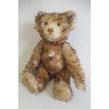 A boxed Steiff replica 1926 teddy, with bi-colour plush, ear button and tag, card label,