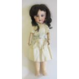 A J Verlingue bisque socket head doll, with blue glass fixed eyes, open mouth, teeth, brown wig,