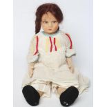 A pre-war Lenci girl doll, with felt head and arms, painted features, brown wig, jointed body,