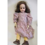 An Armand Marseille bisque socket head doll, with brown glass sleeping eyes, open mouth, top