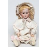 A French bisque socket head doll, possibly Bru, with brown glass sleeping eyes, open mouth, teeth,