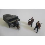 Charbens musical trio set with violin, cello and pianist, figures and piano a bit dusty otherwise,