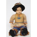 A pre-war Lenci boy doll, with felt head and arms, painted features, jointed body and original