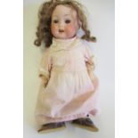 A Porzellamfabrik Mengersgereuth bisque socket head doll, with brown glass sleeping eyes, open