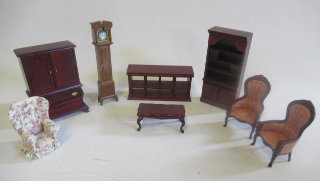 A box of doll's house dolls and furniture, mainly shop pieces, including two shop counters, a