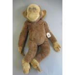 A Merrythought monkey pyjama case, with zip to rear, felt face, hands and feet, label to foot, 24"