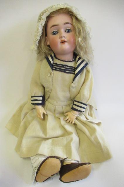 A Max Handwerck bisque socket head doll, with blue glass sleeping eyes, open mouth, teeth, blond