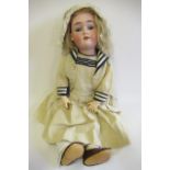 A Max Handwerck bisque socket head doll, with blue glass sleeping eyes, open mouth, teeth, blond