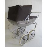 A Silver Cross doll's pram, with sprung base, border pin-stripe decorated paint work, fabric cover