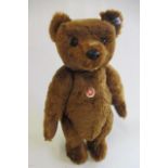 A boxed Steiff 1902 replica bear, with ear button, tag and label, certificate in box, 21" long
