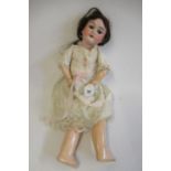 A Max Handwerck bisque socket head doll, with brown glass sleeping eyes, open mouth, upper teeth,