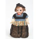 An Armand Marseille googlie eye Dutch girl, with bisque socket head, brown glass sleeping eyes,