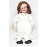 A Kammer & Reinhardt bisque socket head doll, with blue glass sleeping eyes, open mouth, moulded