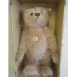 A boxed Steiff replica 1927 teddy Rose, with pink plush, growl, ear button, ear label and
