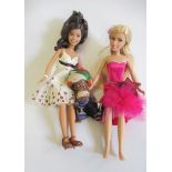 A box of dolls clothing and shoes, including a replica Jumeau dress, together with two late Barbie