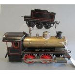 Bing spirit fired 0-4-0 tender locomotive, wind cutter cab finished in black lined red, boiler