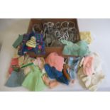 A quantity of mainly woollen dolls clothing, together with a box of doll stands