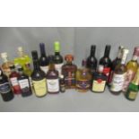 A box of mixed alcohol, including Courvoisier VS cognac, Western Gold Bourbon, Amaretto, Fine