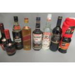 8 mixed bottles, including Johnnie Walker Red Label whisky, Captain Morgan rum, Lamb's Rum, Smirnoff