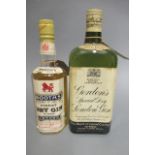 2 bottles of vintage London gin, comprising 1 Gordons Special Dry Gin with snap cap and 1 half