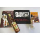 Whisky and related books, comprising one bottle Robbie Burns famed old scotch whisky, one 20cl The