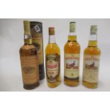 Four bottles of whisky, comprising one litre 10yr old Glenmorangie single malt in tube, one litre