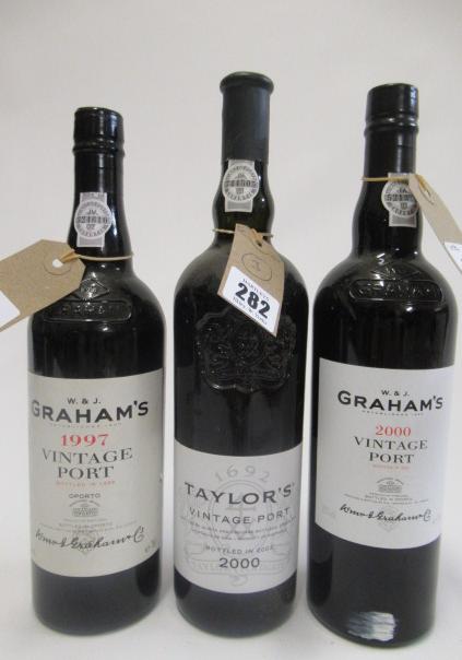 Three bottles of vintage port, comprising Grahams 1997, Grahams 2000 and Taylors 2000