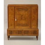 A ROSEWOOD SALON CABINET, first half of the 20th century, of stepped oblong form, the
