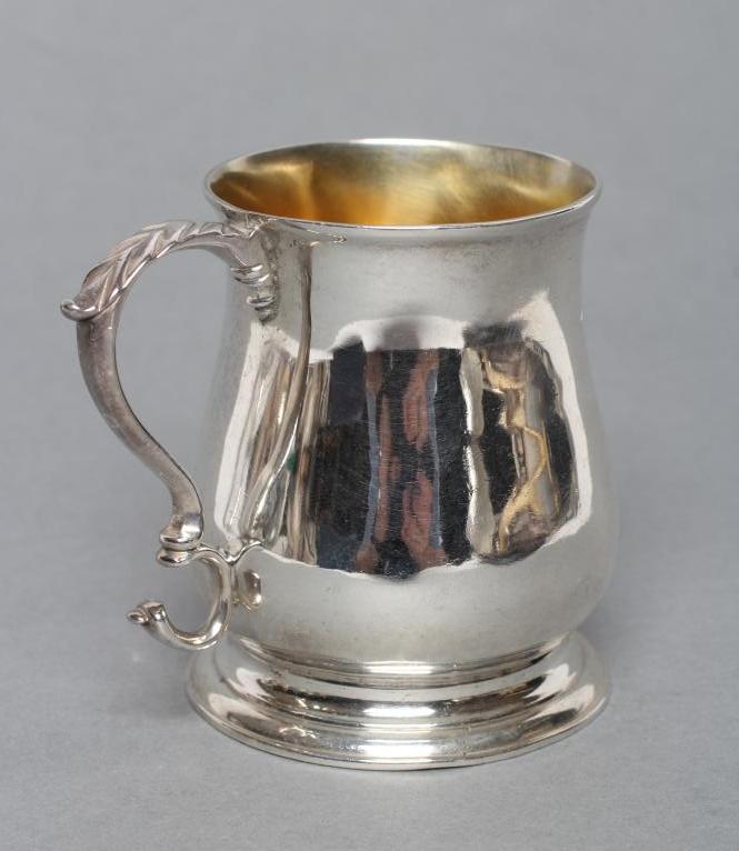 A GEORGE III SMALL MUG, maker possibly William Lukin, London 1763, of baluster form with acanthus