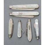 A COLLECTION OF FIVE FOLDING FRUIT KNIVES all with silver blades and mother of pearl handles,