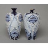 A PAIR OF MACINTYRE MOORCROFT FLORIAN WARE POPPY PATTERN POTTERY VASES, early 20th century, of