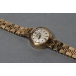 A LADY'S 9CT GOLD JAEGAR LECOULTRE WRISTWATCH, the matt off white dial with applied metal batons and
