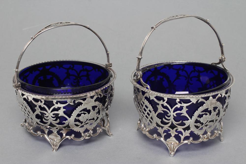 A MATCHED PAIR OF SWEETMEAT BASKETS, maker Mappin & Webb, Birmingham 1911, and maker's mark D & ?,