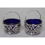 A MATCHED PAIR OF SWEETMEAT BASKETS, maker Mappin & Webb, Birmingham 1911, and maker's mark D & ?,