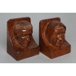 A PAIR OF THOMAS WHITTAKER OF LITTLEBECK ADZED OAK BOOK ENDS of dished oblong form, each carved with