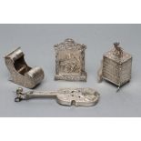 THREE DUTCH WHITE METAL "TOYS", variously marked, comprising a sleigh, tall cupboard, 2 1/2" high,